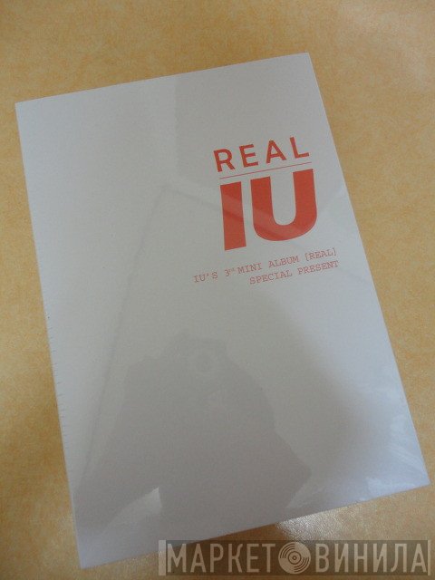 IU   - Real