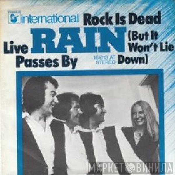 Rain   - Rock Is Dead (But It Won't Lie Down) / Live Passes By